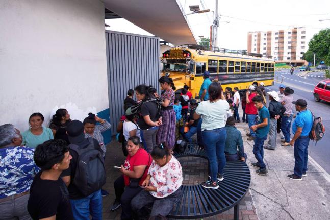 People wait for loved ones from Guatemala deported from the United States outside La Aurora International Airport, in Guatemala City, August 31, 2025. (AP Photo/Moises Castillo, File)