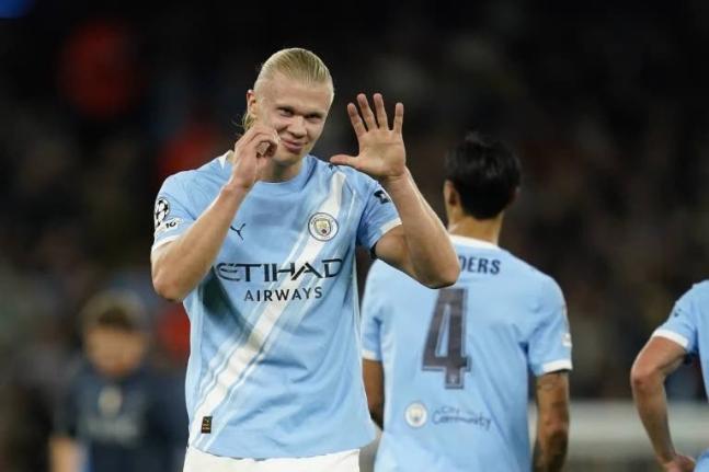 Manchester City’s Erling Haaland celebrates after scoring the opening goal during the Champions League opening phase match between Manchester City and Napoli at the Etihad Stadium in Manchester, England, yesterday. Manchester City won 2-0.