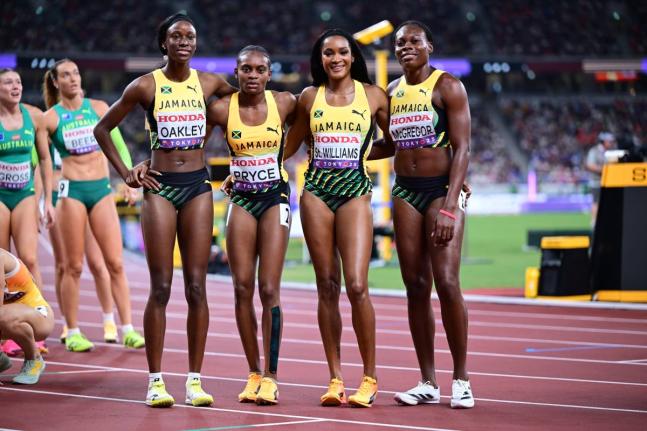 From left: Jamaica's 4x400-metre women, Dejanea Oakley, Nickisha Pryce, Stacey-Ann Williams, and Roneisha McGregor paint a relaxed picture after winning their World Athletics Championships heat in Tokyo, Japan today.