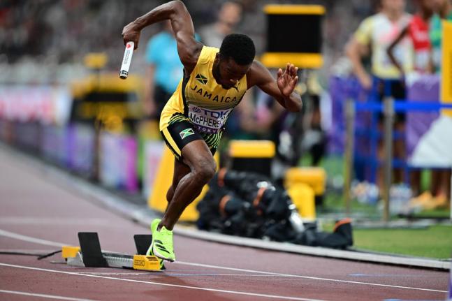 Gladstone Taylor/
Multimedia Photo Editor 
Jamaica’s Bovel McPherson pushes from the blocks on the first leg of the men’s 4x400-metre relay heats at the World Athletics Championships in Tokyo, Japan yesterday. Jamaica advanced after finishing fourth in