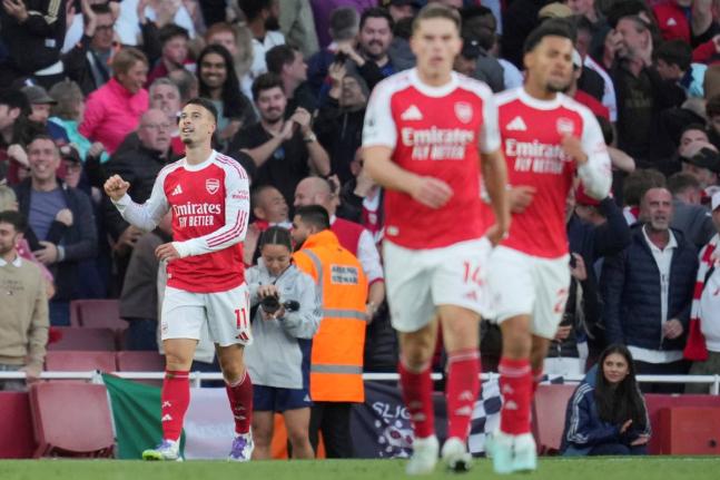 Arsenal's Gabriel Martinelli reacts after scoring during the Premier League football match between Arsenal and Manchester City in London, Sunday, September 21, 2025. (AP Photo/Kin Cheung)