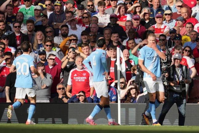 Manchester City’s Erling Haaland (right) celebrates after a goal during the English Premier League  match against Arsenal in London yesterday.