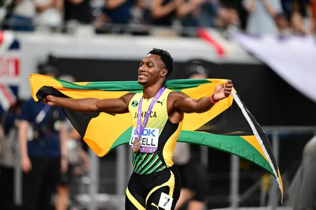 Jamaica’s Bryan Levell celebrates the 200-metre bronze medal he won at the World Athletics Championships inside the Japan National Stadium in Tokyo on Friday. 
