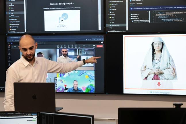 Enio Kaso, head of the Department of Artificial Intelligence and Cryptocurrency Licensing, shows the AI ‘minister’ Diella, whose name means ‘sun’ in Albanian, during a conference call in Tirana.