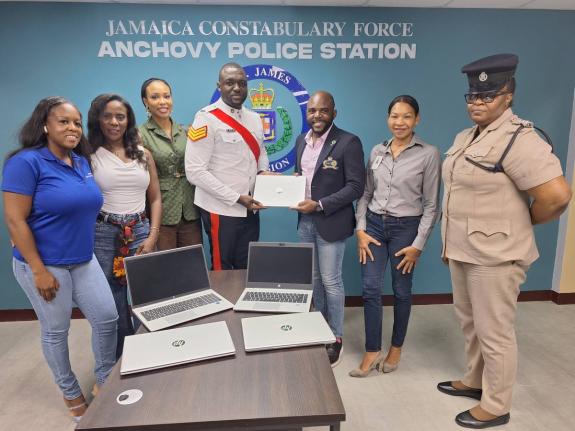 From left: Amber Gail Grandison, vice-president of the Rotary Club of Montego Bay, Yemima Garcia, assistant governor, Michelle Vernon, director of projects, Rotary Club of Montego Bay, Sergeant Fourthney Moore, station manager at Anchovy receiving the lapt