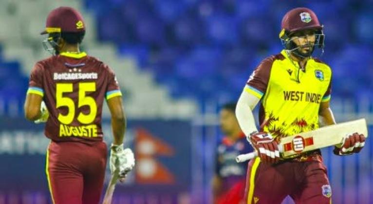 Ackeem Auguste (left) and Amir Jangoo go for a run on their way to a 10-wicket win over the West Indies at the Sharjah Cricket Stadium yesterday.
