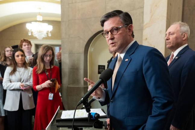 House Speaker Mike Johnson (front), with House Majority Leader Steve Scalise (right), speaks during a news conference at the Capitol in Washington yesterday.