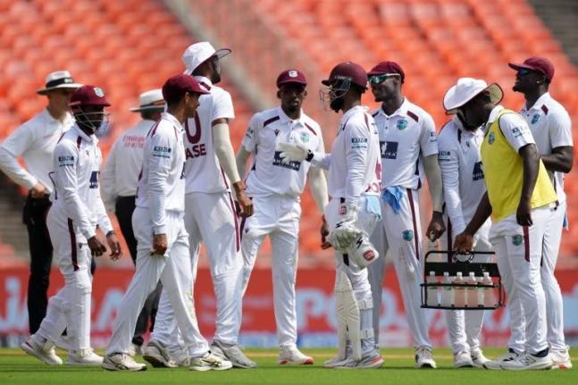 West Indies’ players celebrate the dismissal of India’s captain Shubman Gill on the second day of the first Test at Narendra Modi Stadium in Ahmedabad, India, yesterday.