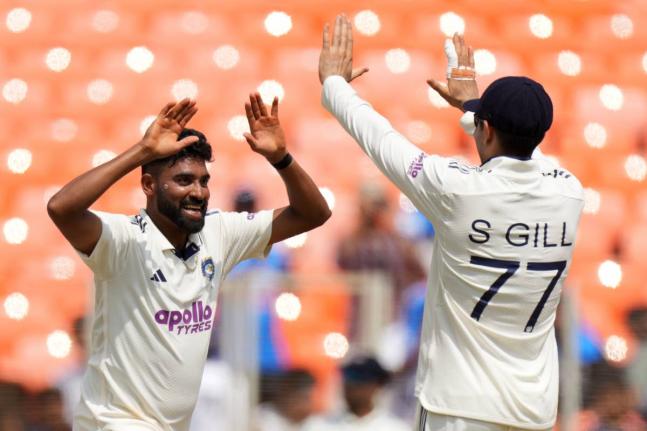 
India’s Mohammed Siraj (left) celebrates with India’s captain Shubman Gill after the dismissal of West Indies’ Justin Greaves on the third day of the first Test cricket match at Narendra Modi Stadium in Ahmedabad, India, yesterday.