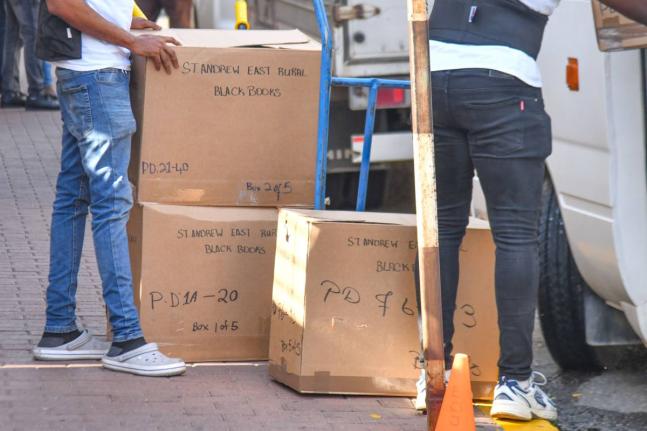In this August photo, Electoral Office of Jamaica workers load ballot boxes in a bus ahead of the 2025 general election. 