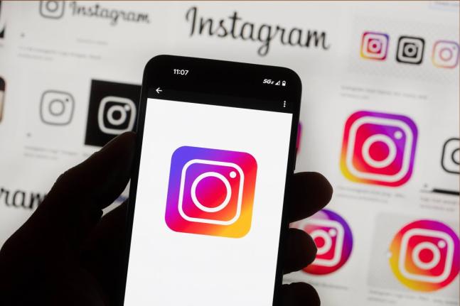The Instagram logo is seen on a cell phone in Boston, October 14, 2022. (AP Photo/Michael Dwyer, File)