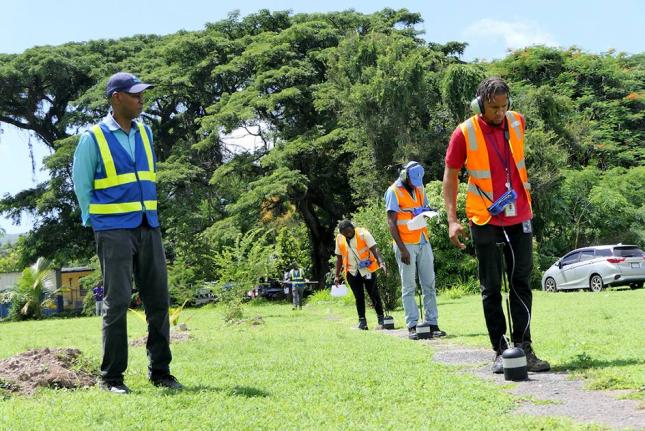 Team Leader Ian Manderson (left) pays careful attention to the work being done by the students – (front to back) Givaughn Jobson, Demar Lewis and Nichol Coleman – during the Leak Detection practical training session recently.