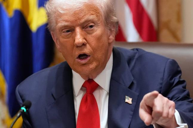 President Donald Trump speaks during a meeting with Argentina's President Javier Milei in the Cabinet Room of the White House, Tuesday, October 14, 2025, in Washington. (AP Photo/Alex Brandon)