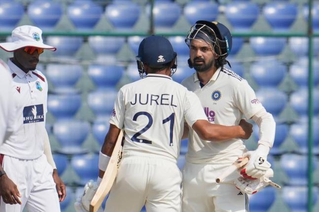 India’s wicketkeeper Dhruv Jurel (left) and KL Rahul congratulate each other after wining the second Test match against the West Indies at the Arun Jaitley Stadium in New Delhi, India, yesterday. Looking on is the West Indies’ Justin Greaves.