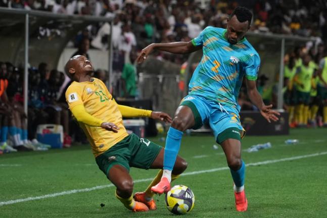 Rwanda's Claude Niyomugabo (right) stops South Africa's Thapelo Morena during a World Cup 2026 group C qualifying football match at Mbombela Stadium, in Nelspruit, South Africa, yesterday.