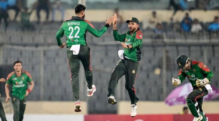 Courtesy of CMC 
Bangladesh’s Rishad Hossain (left) celebrates with teammates  after taking the wicket of Brandon King during the first One-Day International at the Sher-e-Bangla Stadium yesterday.