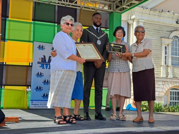 Montego Bay Mayor Richard Vernon (centre) stands with representatives from the Franciscan Sisters of Allegany (from left) Sisters Odette Haddad, Rose Chang, Helen Rose, and Teresita DeSouza, who were presented with the Key to the City of Montego Bay and a 