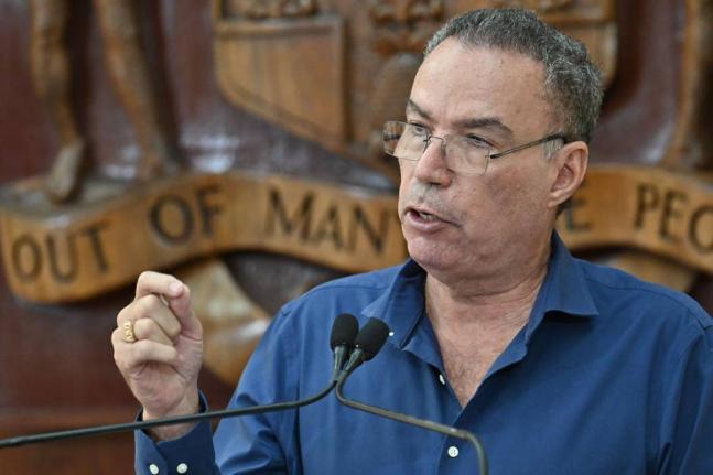 Transport Minister Daryl Vaz speaking at a special press briefing at the Office of the Prime Minister in St Andrew on October 23.