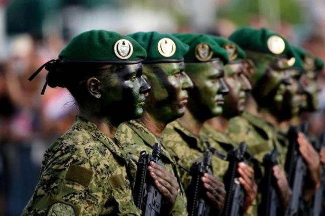 Croatian troops participate in a military parade marking 30 years since a key war victory, in Zagreb, Croatia, Thursday, July 31, 2025.