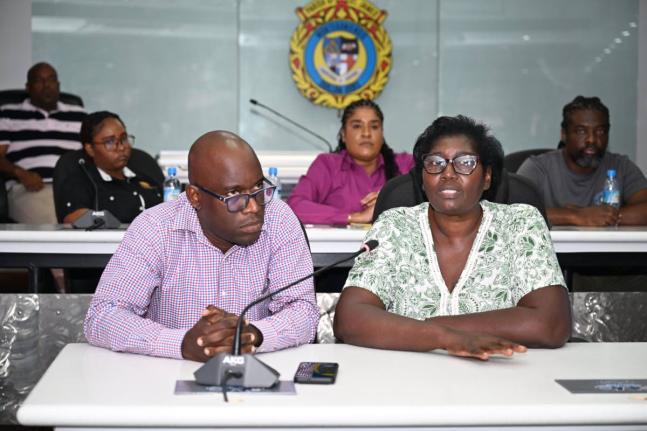 Inspector of Poor for St James, Pauline Lecky, addressing the Emergency Operations Centre (EOC) meeting at the St James Municipal Corporation on Thursday, October 23. Looking on is Public Assistance Division (PAD) Administrator at the Ministry of Labour an