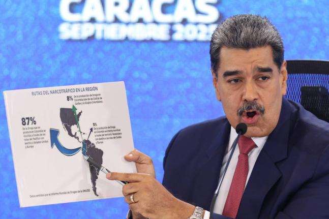Venezuela's President Nicolas Maduro points at a map of the Americas during a new conference in Caracas, Venezuela on September 15, 2025. 

