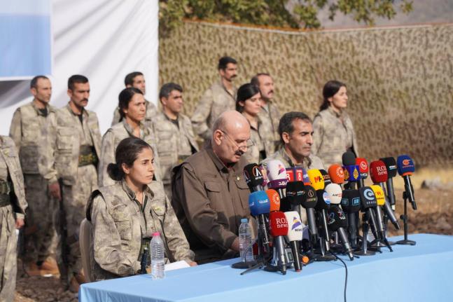 Kurdistan Workers’ Party (PKK) fighters, who reportedly withdrew from Turkey with their weapons, stand to attention during a ceremony in the Qandil area of northern Iraq.