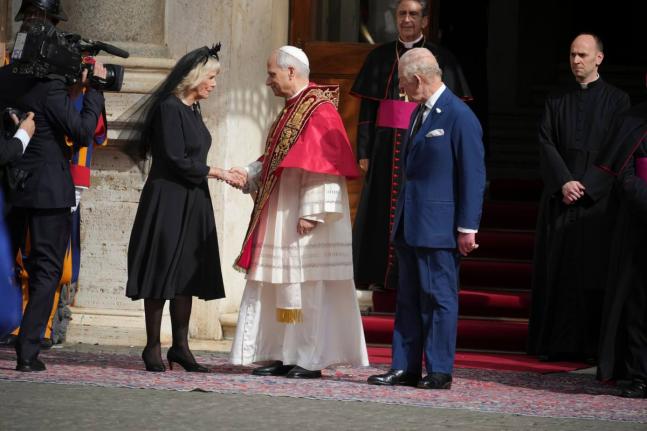 Pope Leo XIV, centre, with Queen Camilla and King Charles III in the St. Damasus Courtyard at the Vatican after a state visit and pray with him in the Sistine Chapel.
