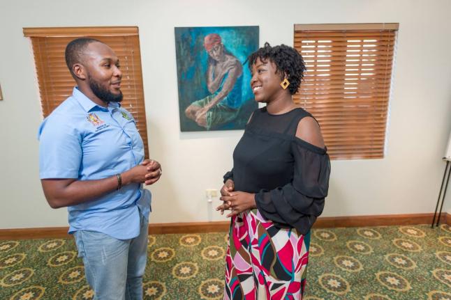 Olivia Shaw-Lovell (right), founder of Men and Women of Destiny Global Limited, and Akeem Bender, project manager – social intervention, Ministry of National Security, discuss expanding mentorship opportunities for at-risk youth under the Citizen Securit