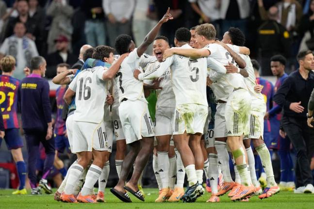 Real Madrid players celebrate after a La Liga match against Barcelona in Madrid, Spain, on Sunday.