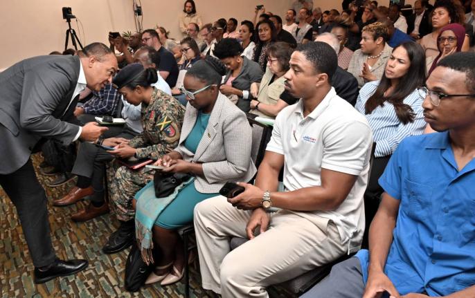 Dr Christopher Tufton (left), minister of health and wellness; with Lieutenant Colonel Gail Ranglin Edwards (second left), director of the Health Services Corps of the Jamaica Defence Force, at the Ministry of Health and Wellness PAHO/WHO Health Cluster Hu