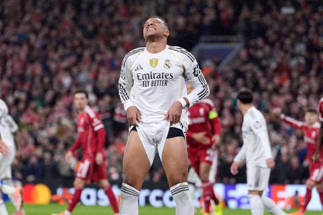 Real Madrid’s Kylian Mbappé reacts during the Champions League football match against Liverpool at Anfield yesterday.