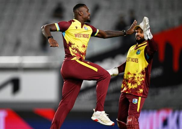 West Indies bowler Jayden Seales (left) celebrates with skipper, Shai Hope after taking the wicket of New Zealand’s Michael Bracewell during the first T20 International between the teams at Eden Park in Auckland, New Zealand, on November 5.