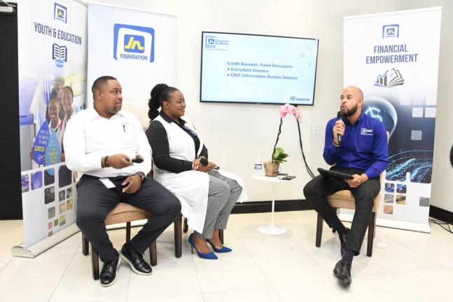 Karon Lewis (right), client relations officer, JN Bank, in discussion with Keith Parkes (left), business development manager at CRIF Information Bureau Jamaica and Janice Knight Chung, sales and marketing officer at EveryData Jamaica at the Smarter Credit 