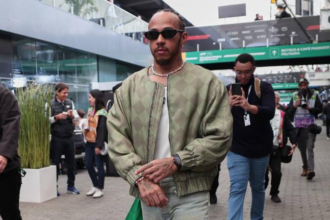 Ferrari driver Lewis Hamilton of Britain arrives at the Interlagos race track ahead of the Brazilian Formula One Grand Prix in Sao Paulo on Sunday.