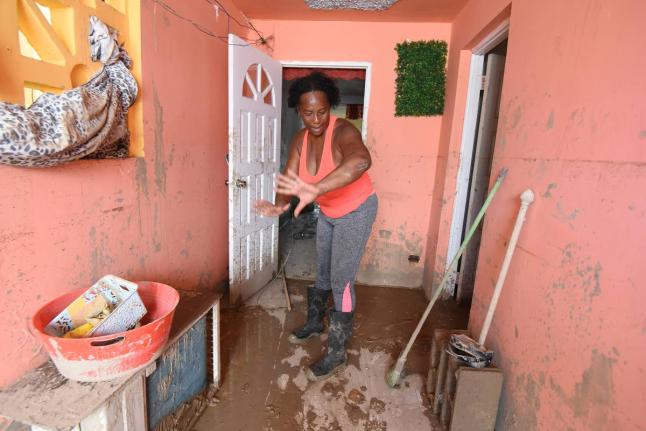 Merris Green from Westgreen/Catherine Hall in Montego Bay, St James, explains how floodwaters from Hurricane Melissa swept through her house destroying all her furnishings.