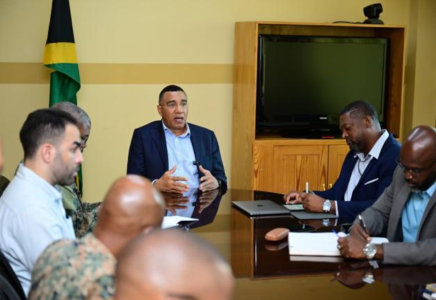 Prime Minister, Dr Andrew Holness (centre), addressing stakeholders during a meeting at the Office of Disaster Preparedness and Emergency Management (ODPEM) in St Andrew on November 12. Participating in the session are ODPEM Director General, Commander Alv