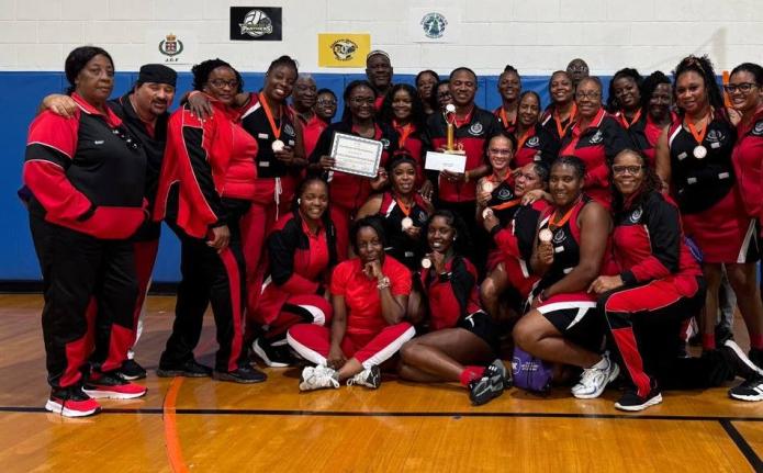 Police Nationals’ delegation poses after winning bronze in the Championship Division of the Florida United Netball Extravaganza at the Miramar Youth Enrichment Center in Florida yesterday.