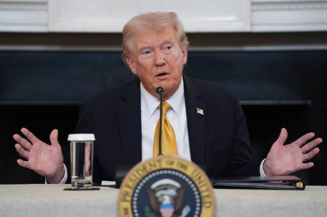President Donald Trump answers questions from reporters during a round-table on criminal cartels in the State Dining Room of the White House, October 23, 2025, in Washington. (AP Photo/Evan Vucci, File)
