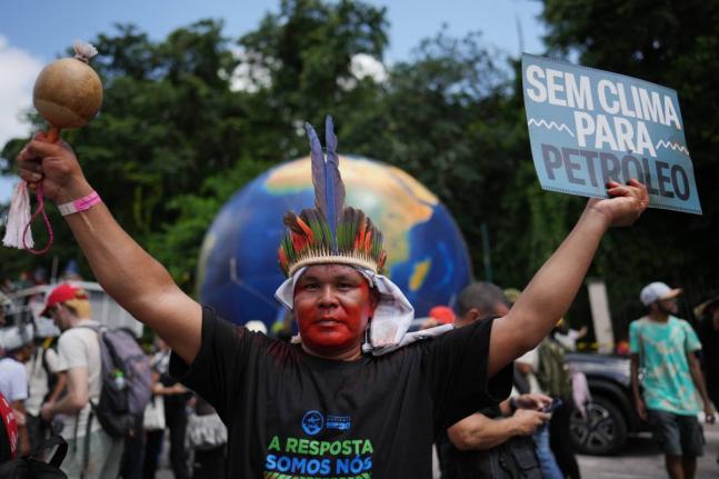 Indigenous activists participate in a climate protest during the COP30 UN Climate Summit, in Belém, Brazil. 