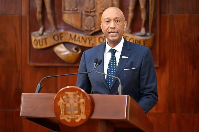 Managing Director, Development Bank of Jamaica (DBJ), Dr David Lowe, addressing a press briefing at Jamaica House on November 26