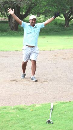 Contributed 
Paul Leyow throws his hands up in celebration after sinking a birdie to win the AMG Buccaneer Golf Tournament in dramatic fashion last Sunday at the Caymanas Golf Club in St Catherine.