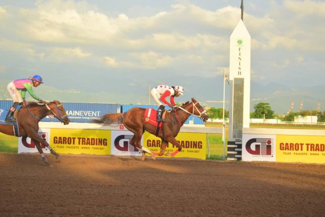 Anthony Minott/Freelance Photographer 
CALIFORNIA CROWN, ridden by Robert Halledeen, wins the Kaz Hosay Trophy ahead of ZULU WARRIOR (Raddesh Roman) over five-and-a-half furlongs at Caymanas Park yesterday.