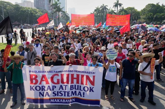 Protesters shout slogans during anti-corruption protest in Manila, Philippines on Sunday, November 30, 2025. 