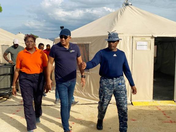 Minister of Health and Wellness, Dr Christopher Tufton (centre), is guided on a tour of the Barbados Field Hospital in Westmoreland by Barbados Defence Force Emergency Medical Team (EMT) Leader, Lieutenant Commander Anderson Goodridge, and Clinical Medical