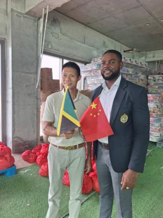 Montego Bay Mayor Richard Vernon (right) and vice-president of the Fujian Association of Jamaica, Yansen Li, at the handing over of Hurricane Melissa relief supplies by Chinese business communities in Montego Bay and Trinidad on Thursday.