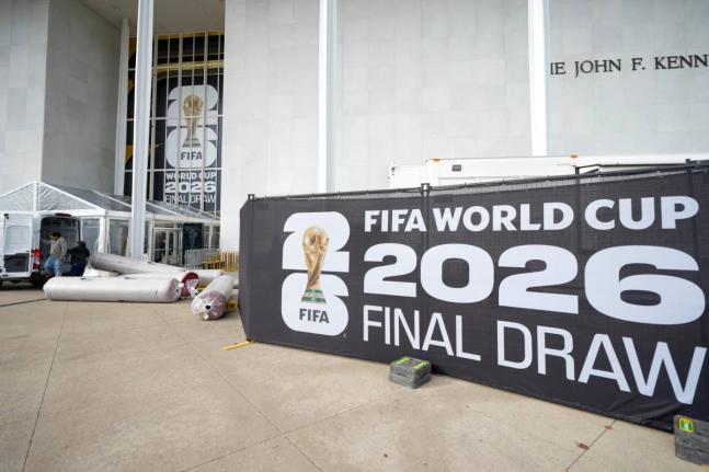 The red carpet is delivered prior to the final draw for the 2026 football World Cup at the Kennedy Center in Washington yesterday.