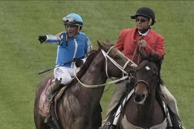  Venezuela-born, United States-based jockey Javier Castellano (left) celebrates after riding Mage to win the 149th running of the Kentucky Derby horse race at Churchill Downs Saturday, May 6, 2023. Castellano, 48, will be in action in the Mouttet Mile at C