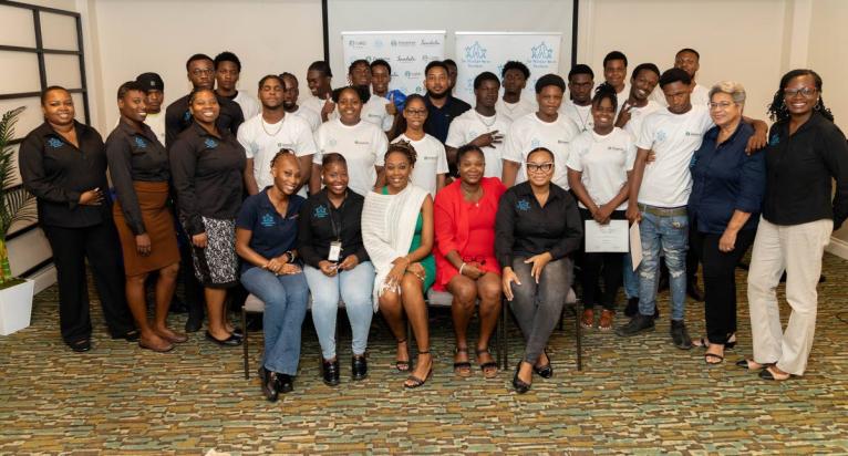 The MultiCare Youth Foundation’ Executive Director Mitzian Turner (right), administrative manager Ann Astwood (2nd right), and senior project officer Ganesh Nactie (centre back in black) led their hardworking team in celebrating their protegees’ and Pr