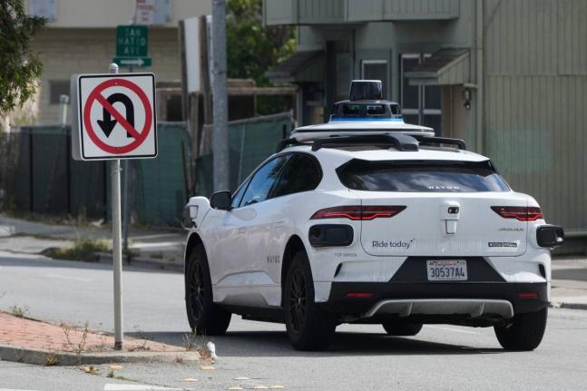 
A Waymo vehicle drives past a ‘No U-Turn’ sign in San Bruno, California, Tuesday, September 30, 2025.