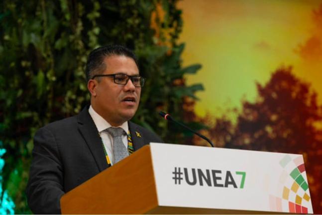 Jamaica’s Minister of Water, Environment, and Climate Change, Matthew Samuda, addresses delegates at the United Nations Environment Assembly in Nairobi, Kenya, on December 12, following his election as president. 